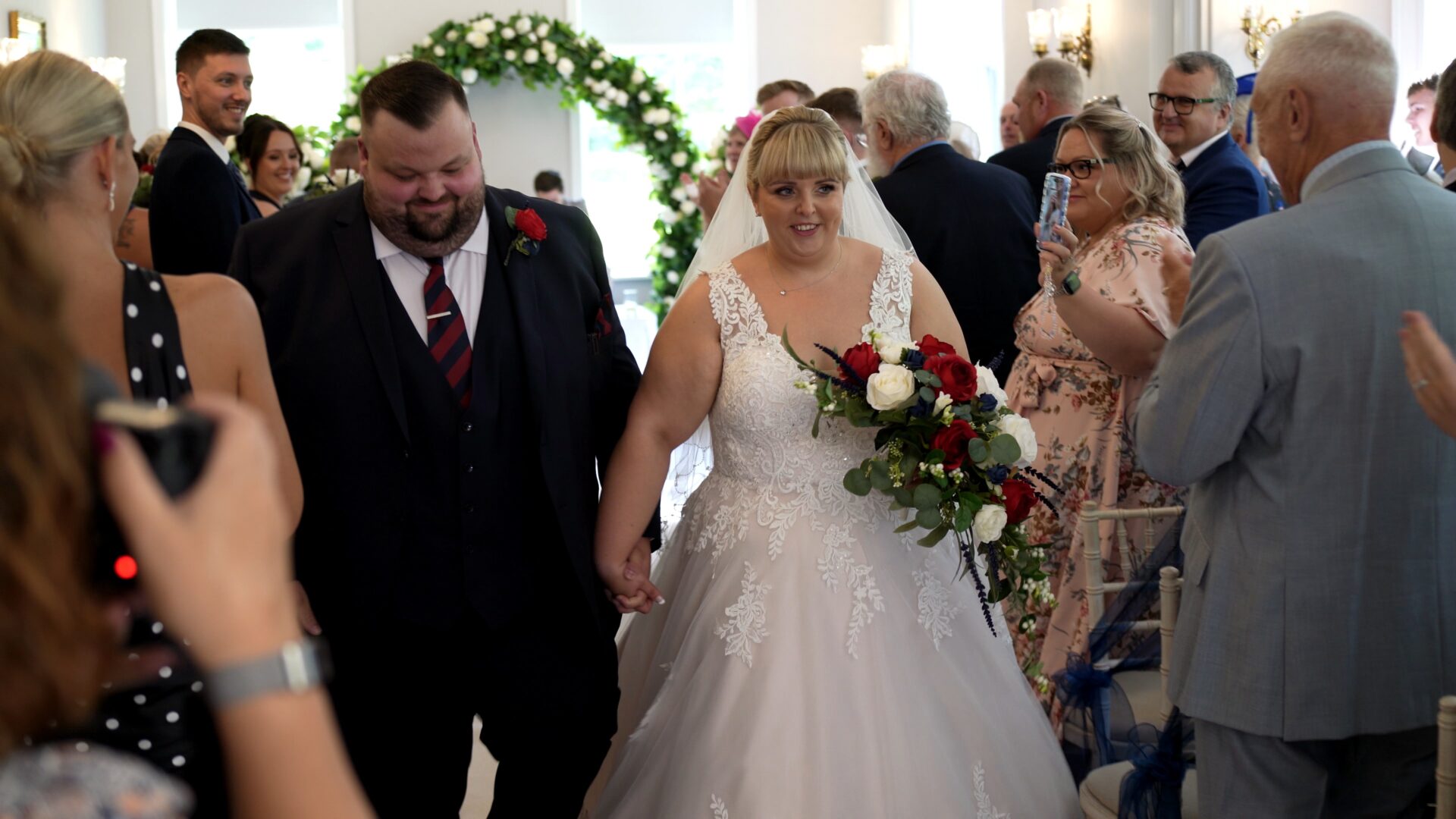 the couple walk back down the aisle