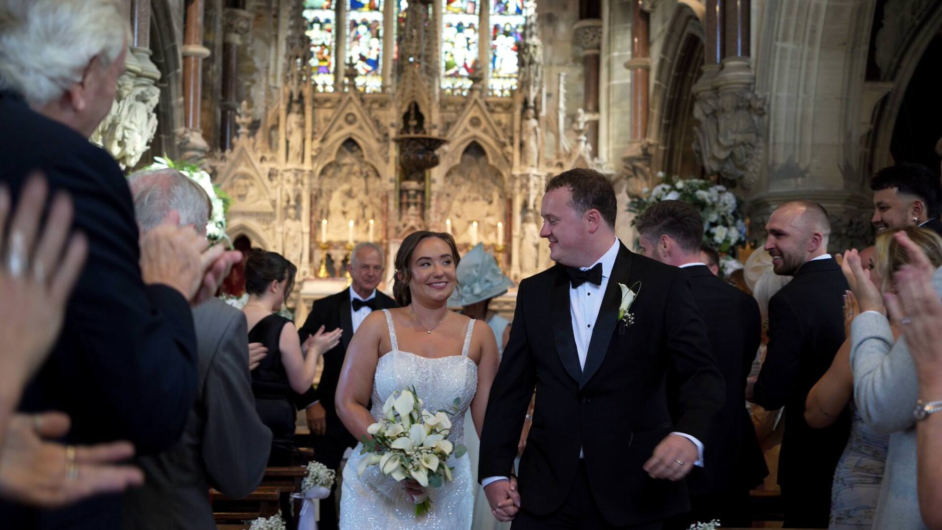 a moment caught on video of the couple knowingly smiling to each other as their walk down the aisle