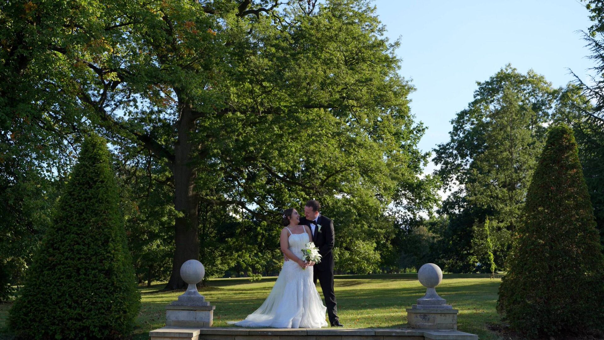 an video still of the couple posing for their photographer at Rudding Park Harrogate