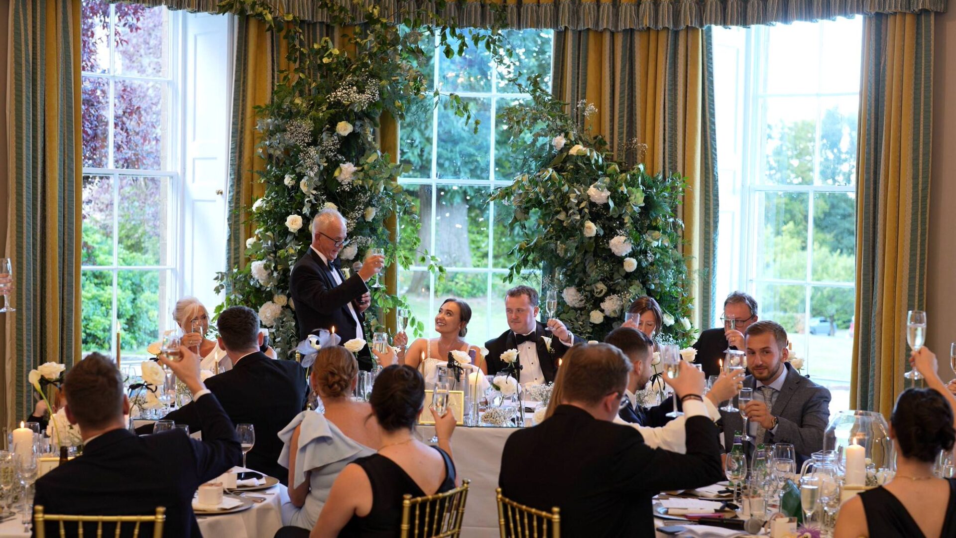 father of the bride toasts the couple at the top table at Rudding Park Harrogate